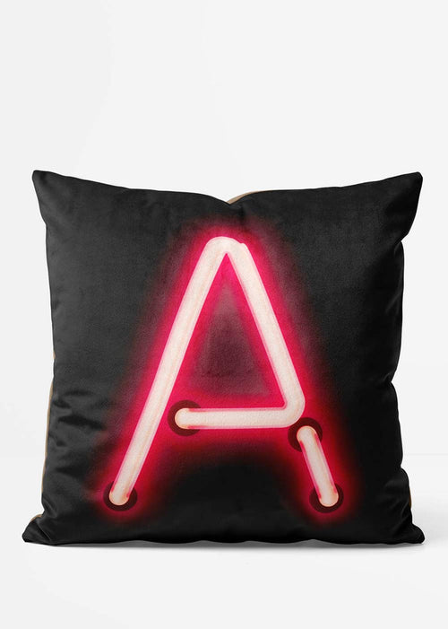 Custom Single Large Neon Letter Black Cushion, front view in red