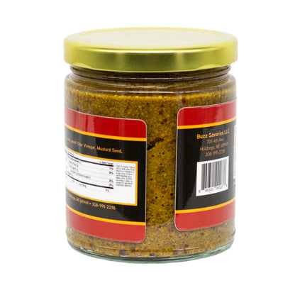 Jar of honey mustard with a gold lid on a white background